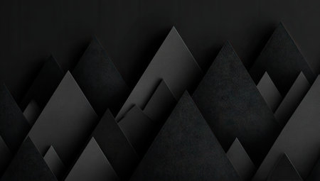Abstract mountain range created with layered dark paper, creating a dramatic shadowed landscapeの素材