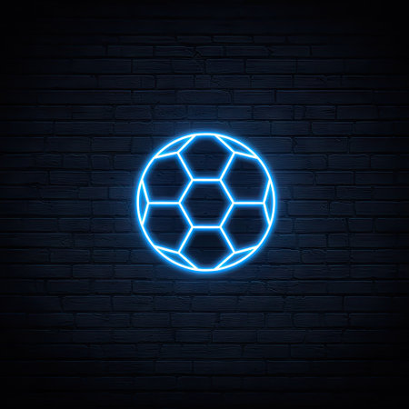 A neon blue soccer ball illustration is centered against a textured dark brick wall. The graphic uses a glowing, luminescent effect, highlighting the hexagonal pattern of the ball. The artwork presents a simple, modern style suitable for various design applications. This image may be suitable for sports-related themes and digital projects.の素材