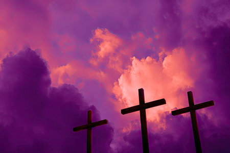 Three dark crosses stand silhouetted against a vibrant sky of purple and orange hues. The composition features a low-angle perspective, capturing a dramatic effect with the light. This image can be suitable for symbolic, religious, or editorial content and could be used in various design projects.の素材