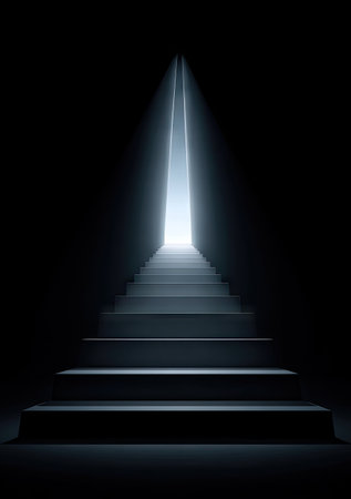 A dark, stylized image depicts a staircase ascending towards a bright light source. The steps are clearly defined, suggesting upward movement. The lighting creates dramatic contrast and shadows. This visual metaphor could be used to represent various themes such as progress, aspiration, or spiritual concepts. Suitable for commercial and editorial applications.の素材