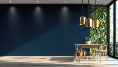 A modern dining room showcases a wooden table and chairs against a dark blue wall. Decorative gold pendant lights hang above the table, while a green wall adds a natural element. The scene is illuminated by soft lighting creating a welcoming ambiance suitable for architectural or design projects.の素材