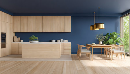 A modern kitchen space features light wood cabinets and a matching island. The room is painted in shades of blue and has a dining area with a wooden table and chairs. The composition is well-lit with sunlight, creating a sense of spaciousness, suitable for architectural design and home decor usage.の素材