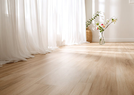 A sunny interior showcases soft, white curtains and a light wooden floor. Sunlight streams in, illuminating a vase with delicate flowers and a woven basket. The scene suggests a tranquil, airy ambiance, perfect for illustrating concepts related to home decor, design, or lifestyle content.の素材