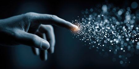 A hand with extended finger touches a field of glowing particles. The image uses a shallow depth of field, highlighting the contact point. The cool color palette and blurred background suggest a digital, abstract environment. This visual could be used in various applications, including technology, innovation, and futuristic concepts.の素材
