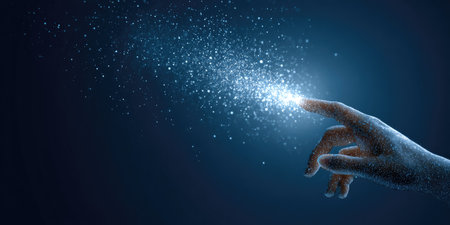 A hand extends towards a collection of bright, sparkling particles, set against a deep blue backdrop. The composition features a soft focus, highlighting the contrast between the hand and the luminous elements. This imagery may be suitable for illustrating concepts related to technology, ideas, or creation.の素材