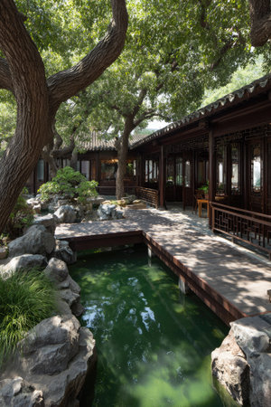 An Asian-inspired garden scene features wooden structures alongside tranquil water. Lush green trees provide shade. The composition showcases a balance between natural elements and architectural design. The image is suitable for various commercial and editorial purposes, including travel and architectural themes.の素材
