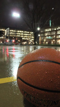 Basketball on the street at night in downtown Toronto, Canada.の素材