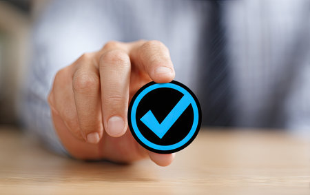 businessman hand pressing check mark button on virtual screen, closeupの素材