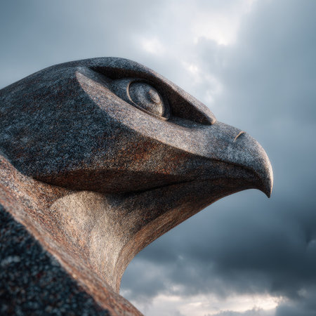 This image showcases a detailed sculpture of an eagle's head, possibly carved from stone. The artwork presents a textured appearance with varying shades of gray and brown. The composition features a strong perspective with dramatic overhead lighting. It could be suitable for editorial or commercial projects.の素材