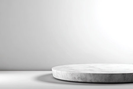 A close-up view displays a circular platform in a minimalist style against a white backdrop. The platform has a textured, marble-like appearance. Overhead lighting casts a subtle shadow. The design could be used for advertising products, showcasing items, and other commercial uses.の素材