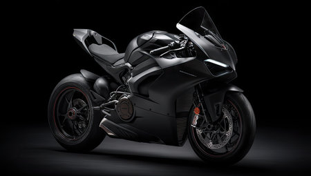 A modern black motorcycle is showcased against a deep black backdrop, emphasizing its silhouette and design. The image highlights the vehicle's curves and details with a studio-like lighting setup. This dynamic composition could be used for promotional materials, automotive industry content, or design projects.の素材