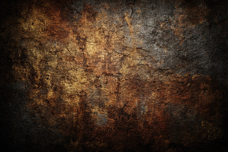 This image presents a textured background featuring a blend of brown, gold, and dark tones. The rough surface showcases a grunge style with variations in color and pattern. It could be suitable for various design applications, including graphic design, web backgrounds, and print projects. It may serve as an element of art for commercial or editorial usage.の素材