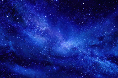 This image showcases a breathtaking depiction of space with a deep blue background. The composition features a multitude of stars and galaxies. The visual style uses a painterly technique. Ideal for various creative projects, this image can be used in publications and digital media.の素材