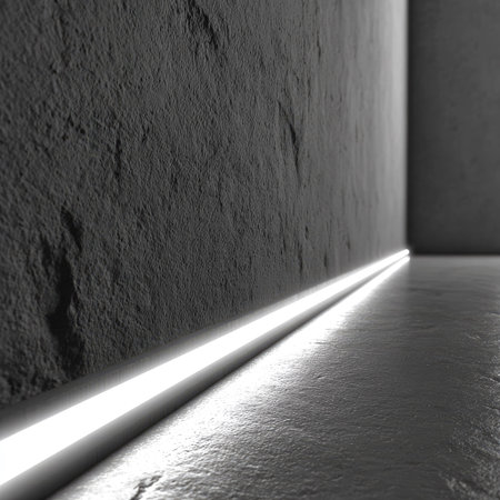 This image features a modern interior design with a focus on an illuminated wall and floor. The scene showcases a linear light source creating a bright glow along the wall. The composition uses a minimalist aesthetic. The image could be used for architectural, design, or commercial projects.の素材