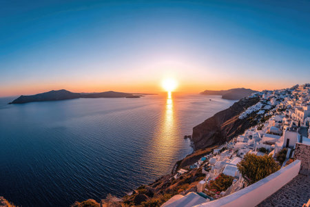 The image showcases a stunning sunset over the ocean. The composition includes islands, a coastal town, and a vibrant sky with orange and blue hues. The scene presents a moment of tranquility with potential uses in travel, tourism, or scenic landscape projects.の素材