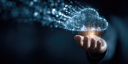 An image presents a human hand cradling a luminous cloud-shaped digital construct. It showcases blue and white colors with a blurred bokeh effect, simulating data transfer. The composition uses soft lighting in a dark setting. Suitable for themes related to technology, networking, and data storage. It is ideal for various commercial and editorial applications.の素材