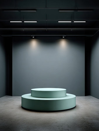 This image showcases a minimalist stage design featuring two circular platforms in a dim setting. The platforms are highlighted by overhead lighting against a plain gray background. The composition, dominated by geometric shapes and muted tones, suggests a modern and versatile space suitable for various commercial applications and presentations.の素材