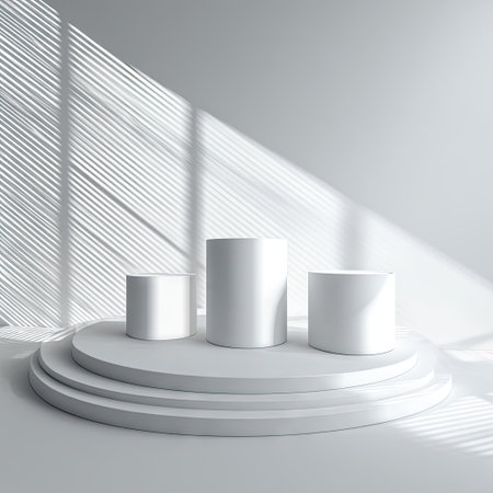 A minimalist composition showcases three white cylindrical objects on a circular tiered platform. Overhead sunlight creates sharp, linear shadows across the scene. The image displays a clean, modern aesthetic with a focus on simplicity, suitable for showcasing products or concepts. The setting is likely indoors, offering potential applications for commercial use.の素材