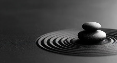 Black and white zen stones on a black background. Zen conceptの素材