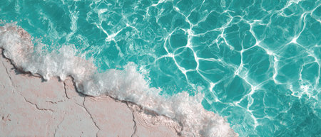 Top view of turquoise sea water with sandy bottom and wavesの素材