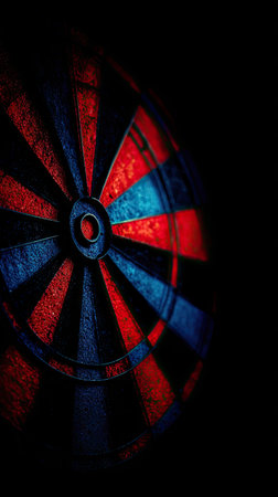 Dartboard on a black background with red and blue stripes.の素材