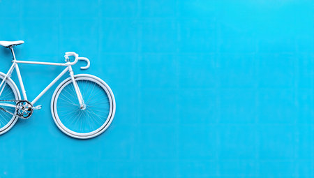 Bicycle on blue wall background with copy space for your text.の素材