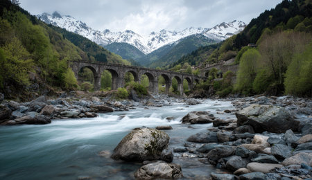 Old bridge over a mountain river in the Pyrenees, Franceの素材