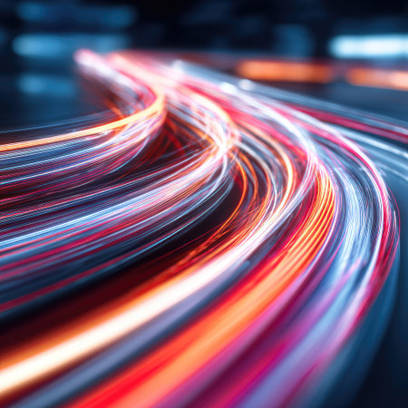 Abstract image showcases vibrant trails of light, suggesting movement and velocity. The composition features flowing lines in shades of red, orange, and blue. The visual style uses long exposure, creating an impression of speed and connectivity. Suitable for various design projects and visual content.の素材