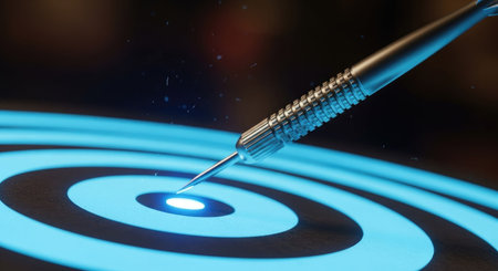 Blue dart in the center of a target on a dark background.の素材