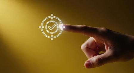 Close up of finger touching with finger target icon on yellow background.の素材