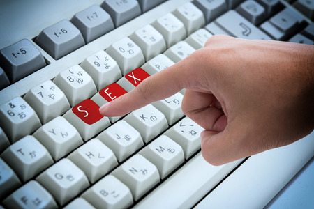 Finger pressing button Keywords xxx on keyboard computerの写真素材