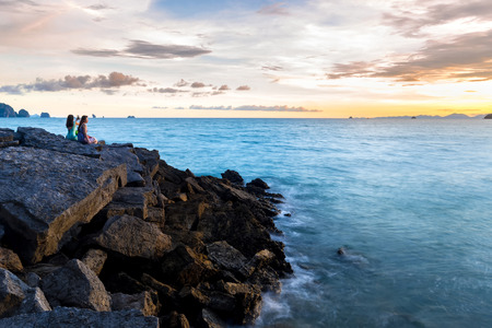 KRABI; THAILAND - May 10, 2015:A woman sit beside the sea. Concept of friendly family;May 10; 2015 in Krabi; thailand.のeditorial素材