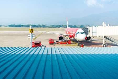CHIANG MAI; THAILAND -JAN 21, 2015:Airplane by airasia airline at Chiang Mai International Airport;January 21; 2015 in chiang mai; thailandのeditorial素材