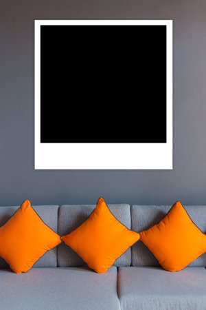 Black Photos on top living room sofa