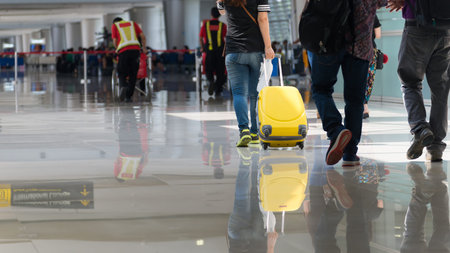 Departure lounge at the airport with traveller and luggage