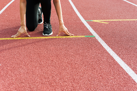 Female Hands on starting line waiting for the start in running track, workout sessionの写真素材