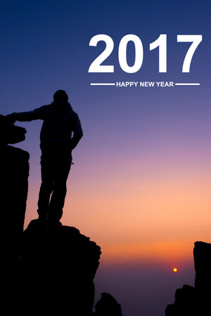 Silhouette of people on mountain at sunset arms raised up above head in celebration with text New...