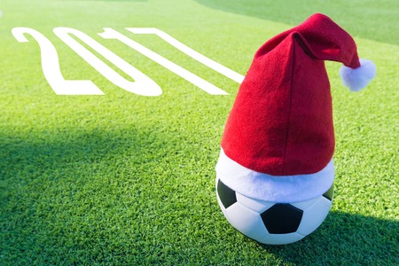 Santa Claus red hat on soccer ball with text new year 2017の写真素材