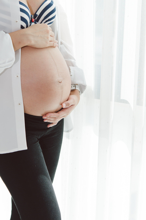 Belly of a Pregnant Woman is next Momの写真素材