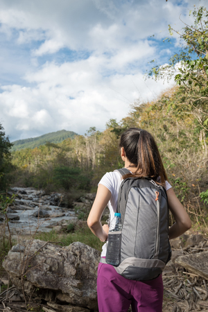 Young Traveler Hikers with backpacks walking in mountainsの写真素材