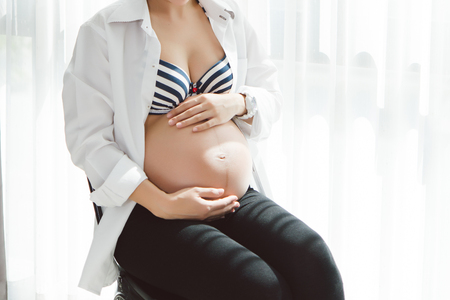 Belly of a Pregnant Woman is next Momの写真素材