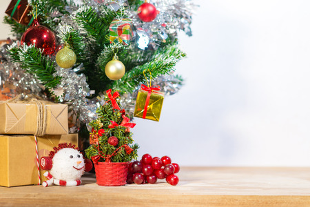 Christmas decorations backdrop merry Xmas Happy new year, Christmas tree and Gift box Gold Bokeh and fireworks backgroundの写真素材