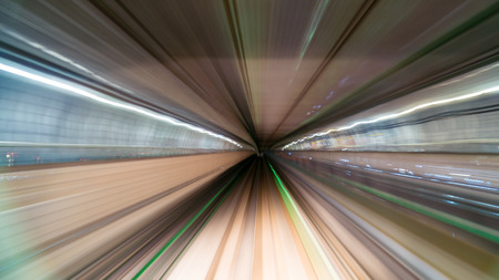 Blurred image of Subway tunnel with Motion blur of a monorail Train futures of transport in modern cityの写真素材