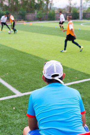 blurred image of Coach is coaching Children Training In Soccer Teamの写真素材