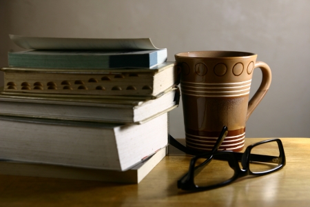 Coffee Break - Books  A photo of a coffee mug, eyeglasses and booksの写真素材