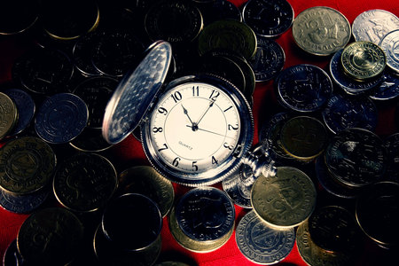 watch surrounded by coinsの素材