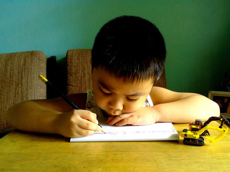 little boy writing