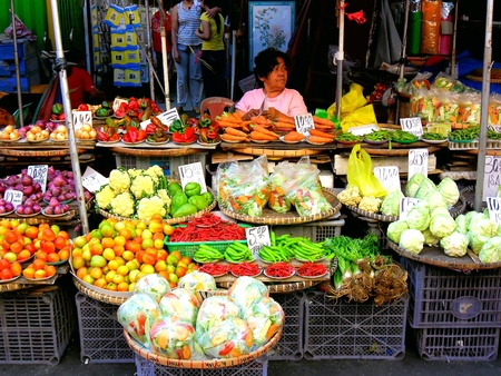 Asian street vendor selling vegetables and other food in quiapo, manila, philippines in asiaの素材