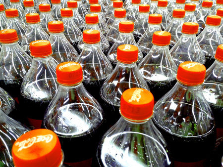 Soda drink in pet or plastic bottles