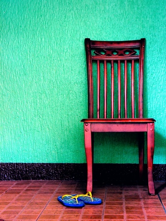 Wooden chair and a pair of flip flopsの素材